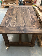 Load image into Gallery viewer, Farmhouse-style dining table.
